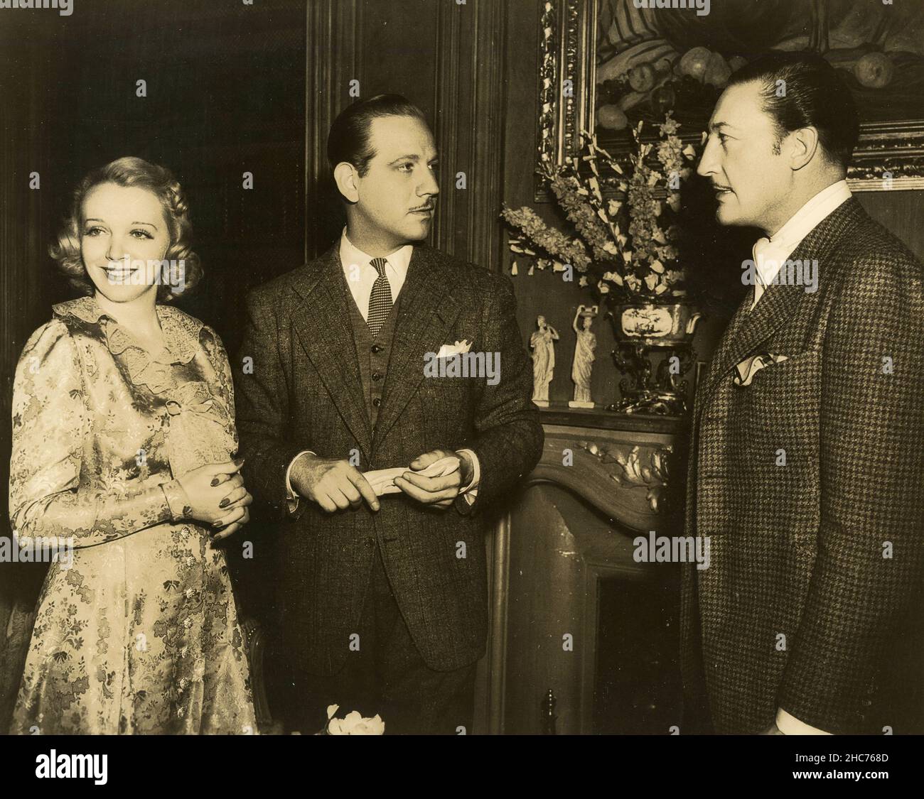 American actors Melvyn Douglas, Virginia Bruce, and Warren William in the movie Arsene Lupin Returns, USA 1938 Stock Photo