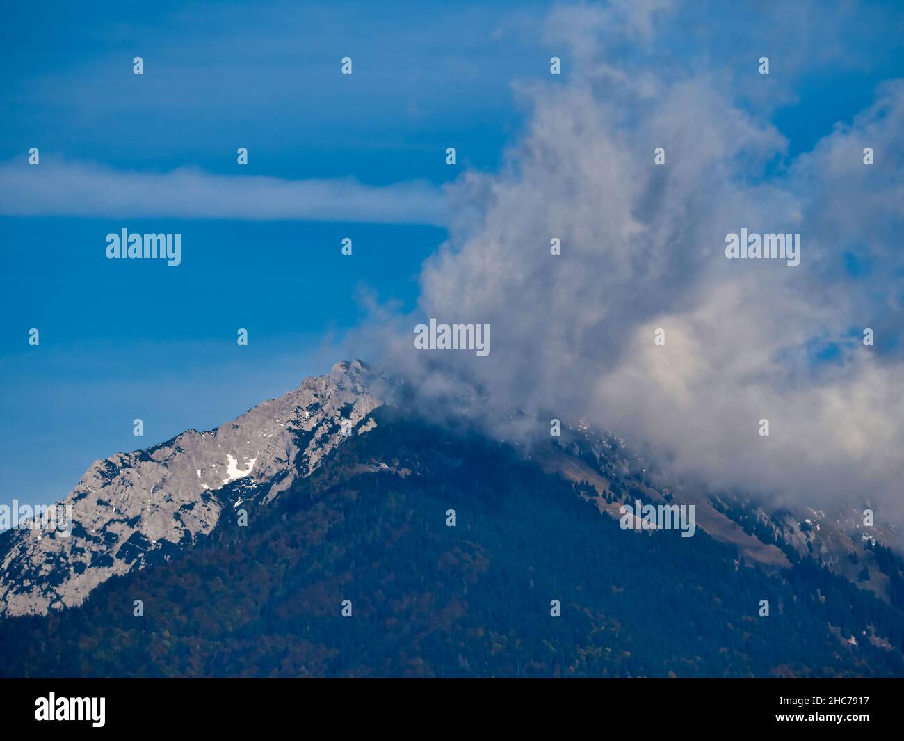 A beautiful mountain landscape with a cloudy summit Stock Photo