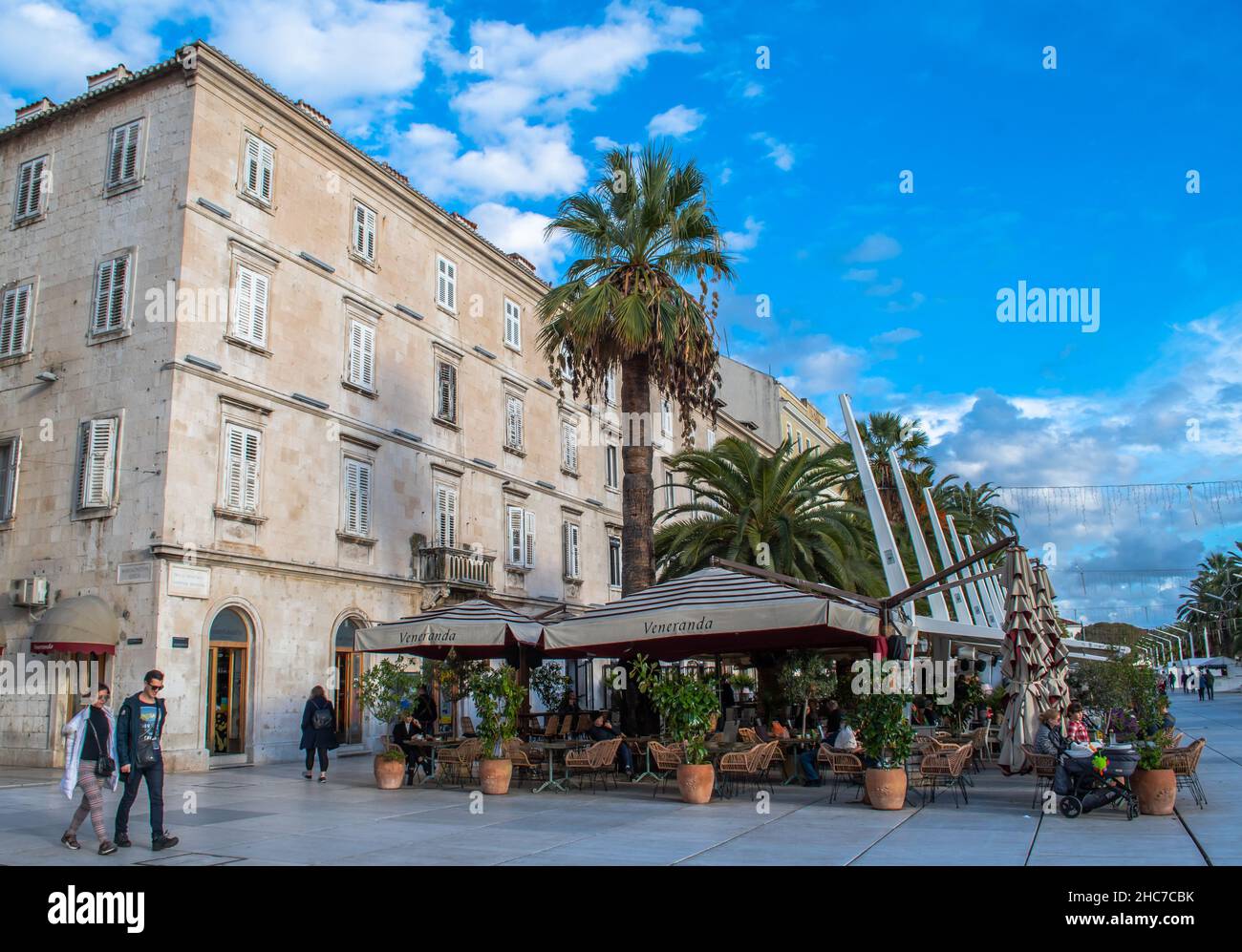 Split, Croatia-The Riva, waterfront walkway lined with restaurants and cafes, a popular gathering place for locals and tourists Stock Photo