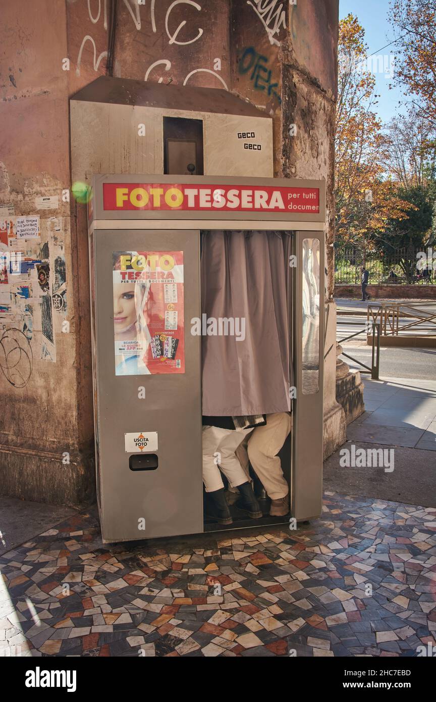 Rome, Latio, Italy - 12-17-2021: People taking selfies in a photo booth in the streets of Rome, Italy. Stock Photo