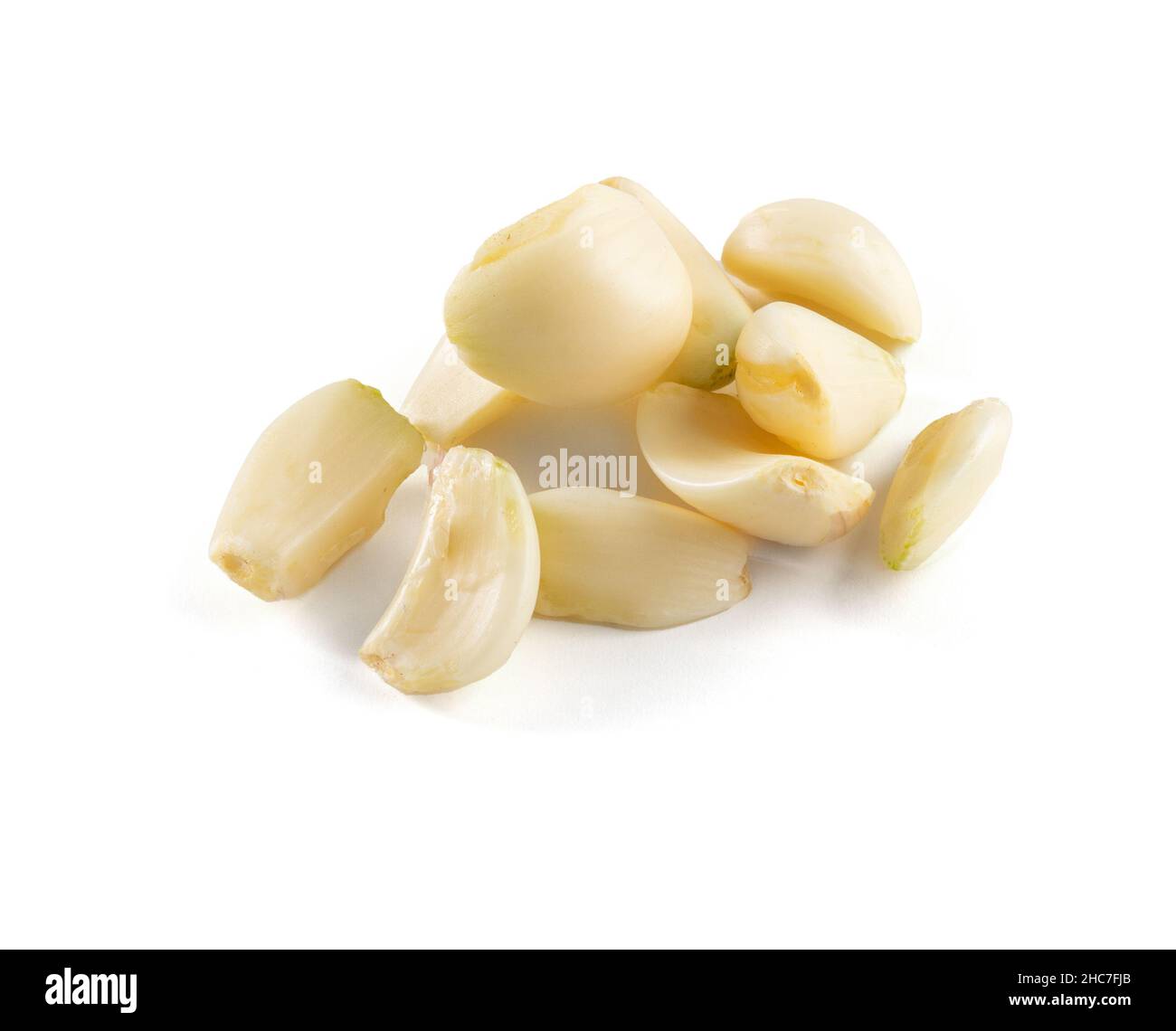 Fresh garlic peeled to be cooked on a white background Stock Photo - Alamy