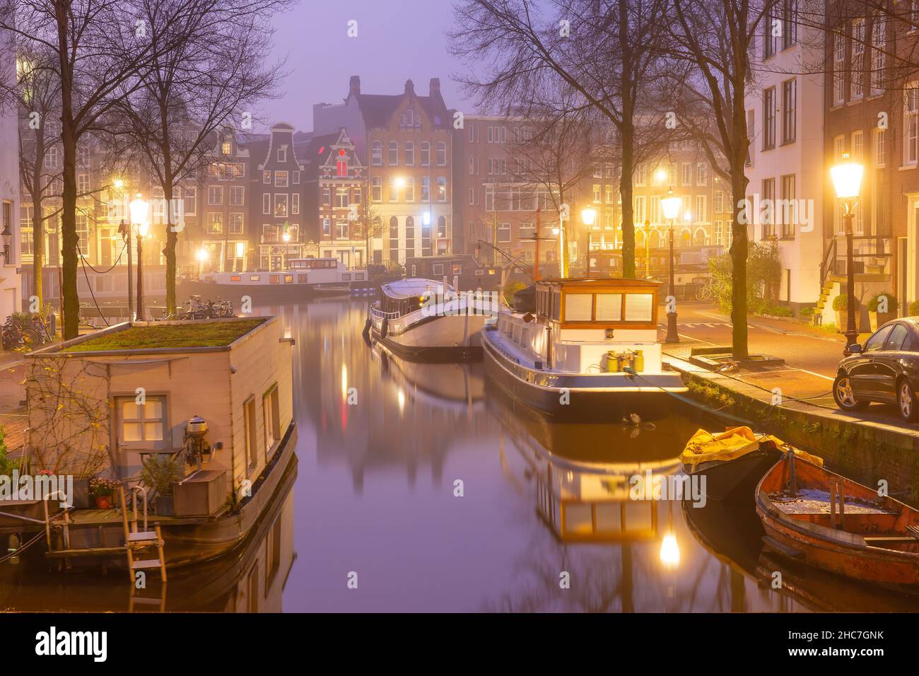 Evening Amsterdam canal Groenburgwal in the morning mist, Holland, Netherlands. Stock Photo
