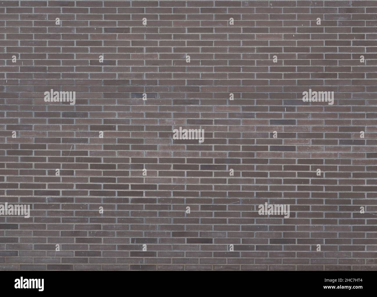 Dark brown bricks dirty wall background with little paint stains Stock ...