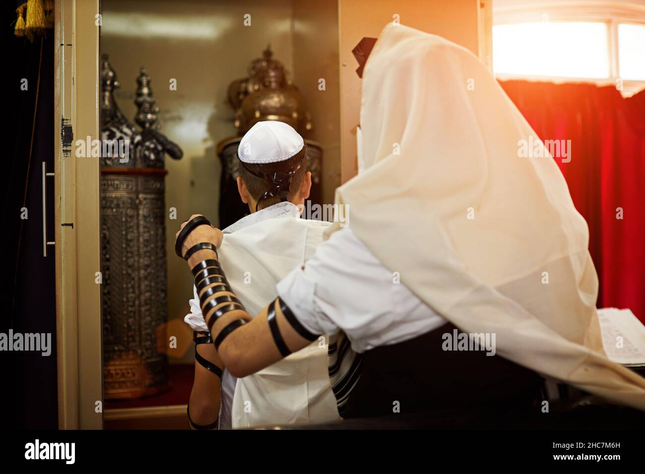 View of unknown people participating in a Bar Mitzvah ritual at the synagogue Stock Photo