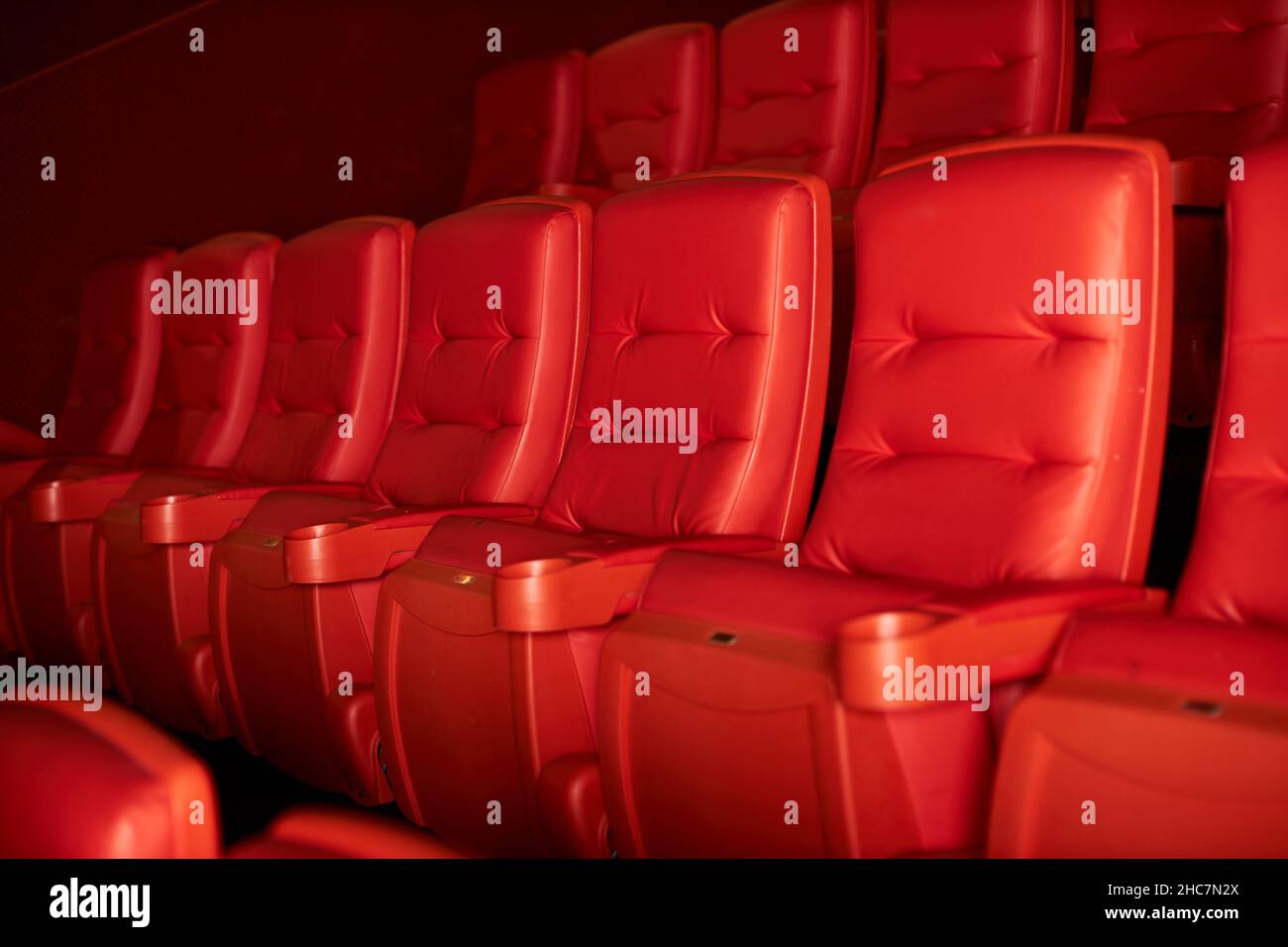 Empty rows of red theater or movie seats Stock Photo