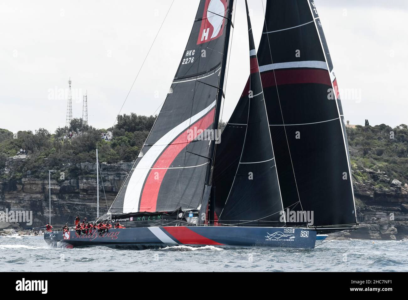 Sydney Harbour, Sydney, Australia. 26th Dec, 2021. Rolex Sydney Hobart Yacht Race; SHK SCALLYWAG 100 skippered by David Witt takes the lead as the fleet approaches the Heads Credit: Action Plus Sports/Alamy Live News Stock Photo