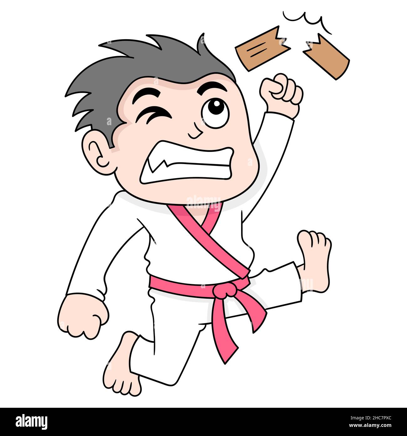 boy is practicing martial arts hitting a wooden plank until it breaks