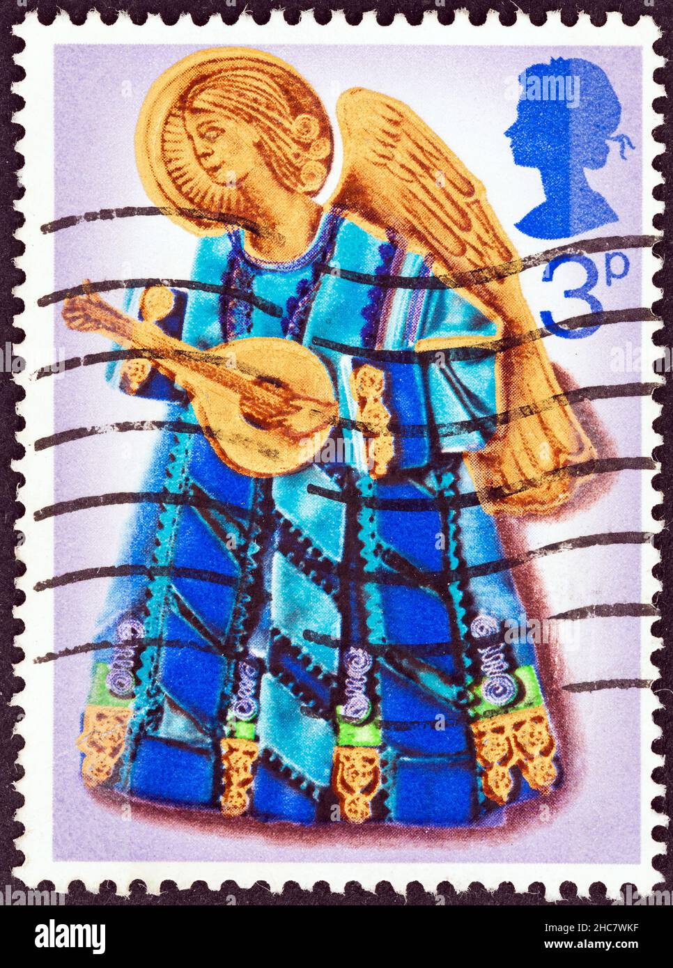 UNITED KINGDOM - CIRCA 1972: A stamp printed in United Kingdom from the "Christmas " issue shows Angel playing lute, circa 1972. Stock Photo