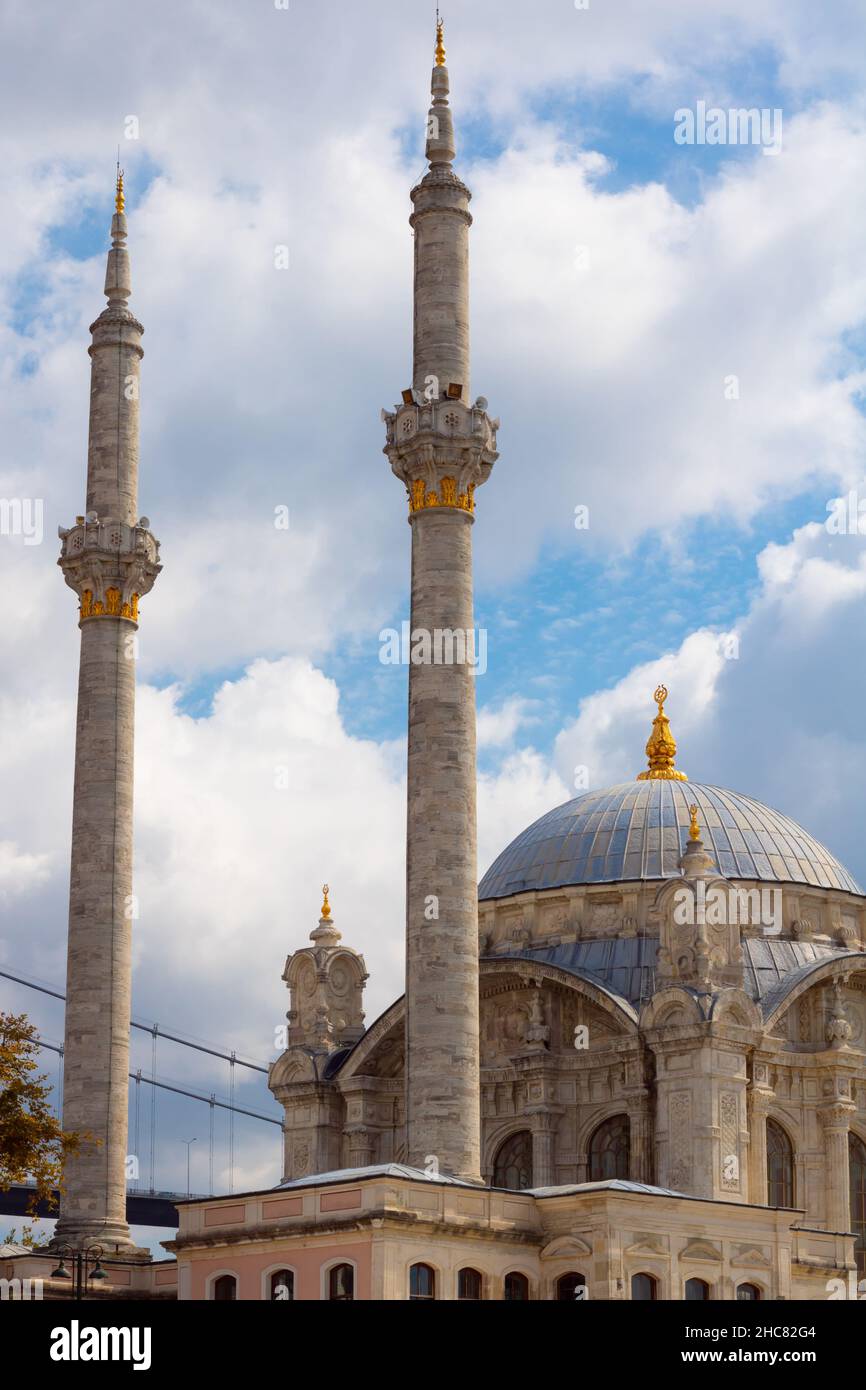 Ortakoy Mosque. Ortakoy Mosque and cloudy sky on the background. Ramadan or islamic vertical story background photo. Stock Photo