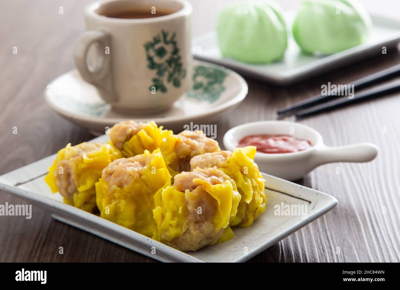 Siu Mai Chinese steamed pork dumplings in bamboo steamers Stock Photo