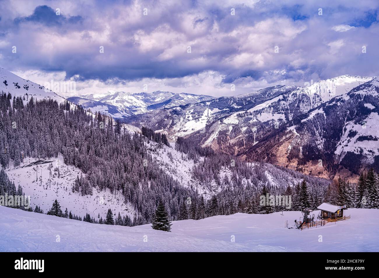 Mountains in Alps with falling snow, Rauris ski resort, Austria Stock Photo