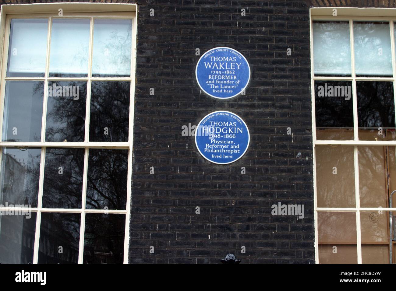 Blue Plaques on the wall of the former home of Thomas akley and Thomas Hodgkin. London, UK. Stock Photo