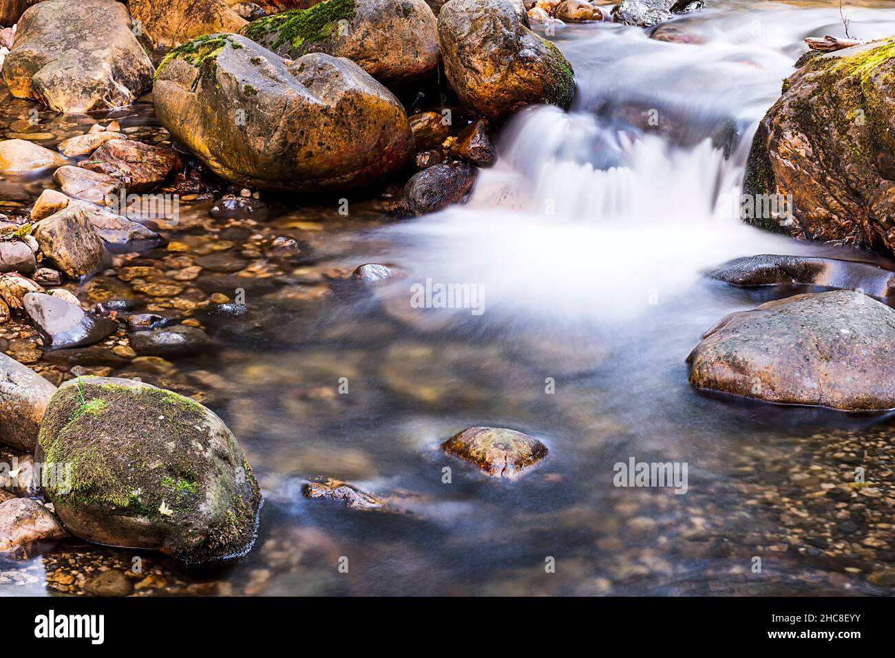 Close-up of a river with silky water effect.The photo has been taken on the Alba route that starts from the famous Asturian town Soto de Agues. Stock Photo