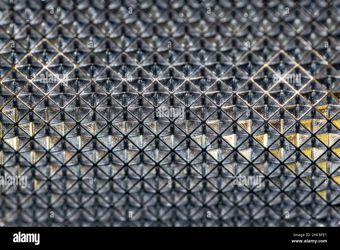 abstract background embossed glass. Shaped headlight glass texture