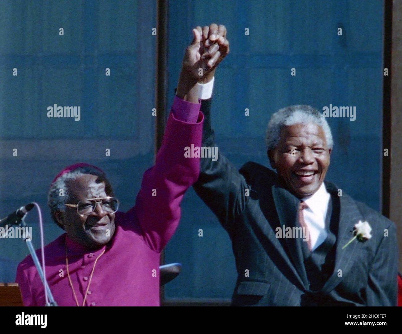 Nelson Mandela, right, holds hands with Bishop Desmond Tutu in Cape Town, South Africa, in a 1994 file image. Mandela died on Thursday, Dec. 5, 2013. (Photo by Jerry Holt/Minneapolis Star Tribune/MCT/Sipa USA) Credit: Sipa USA/Alamy Live News Stock Photo