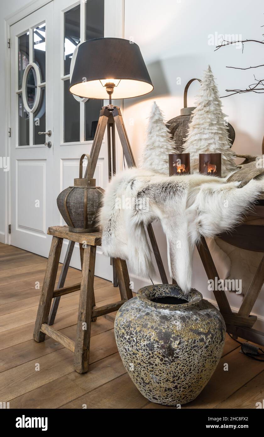 Still life with reindeer fur and winter Christmas themed living room decoration. Stock Photo