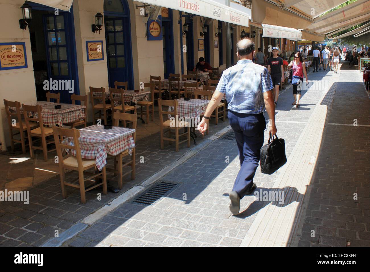 Greece, Athens, July 16 2020 - Street with traditional restaurants at the touristic district of Monastiraki. Stock Photo