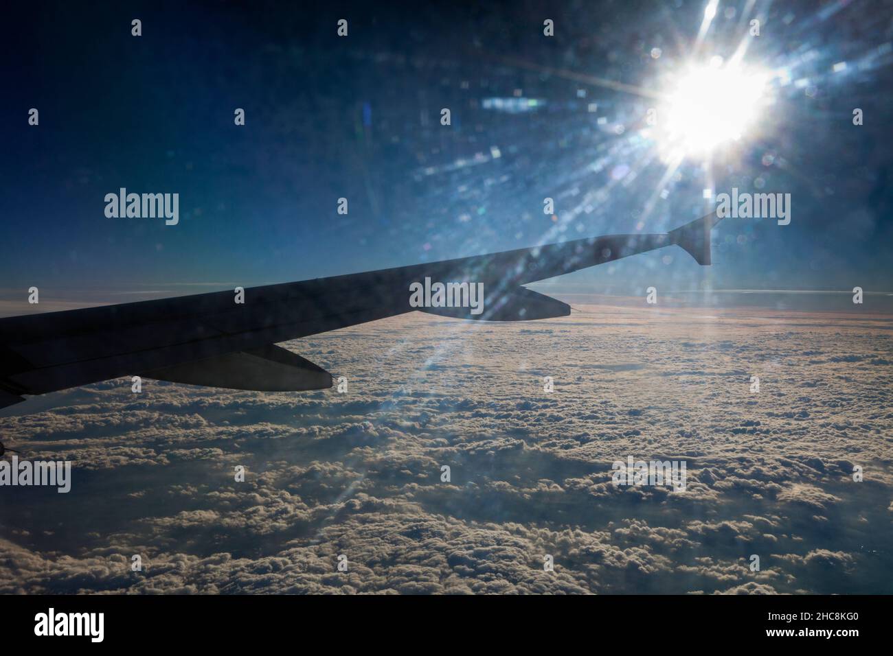 Setting Sun, viewed from an airliner, over the clouds, on a flight from Munich to Cyprus Stock Photo