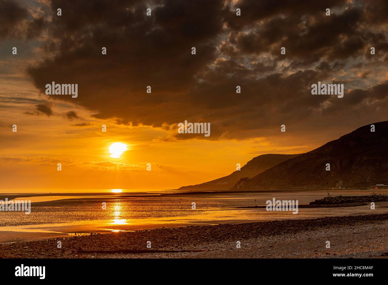 Sunset over Llandudno West Shore, North Wales coast Stock Photo