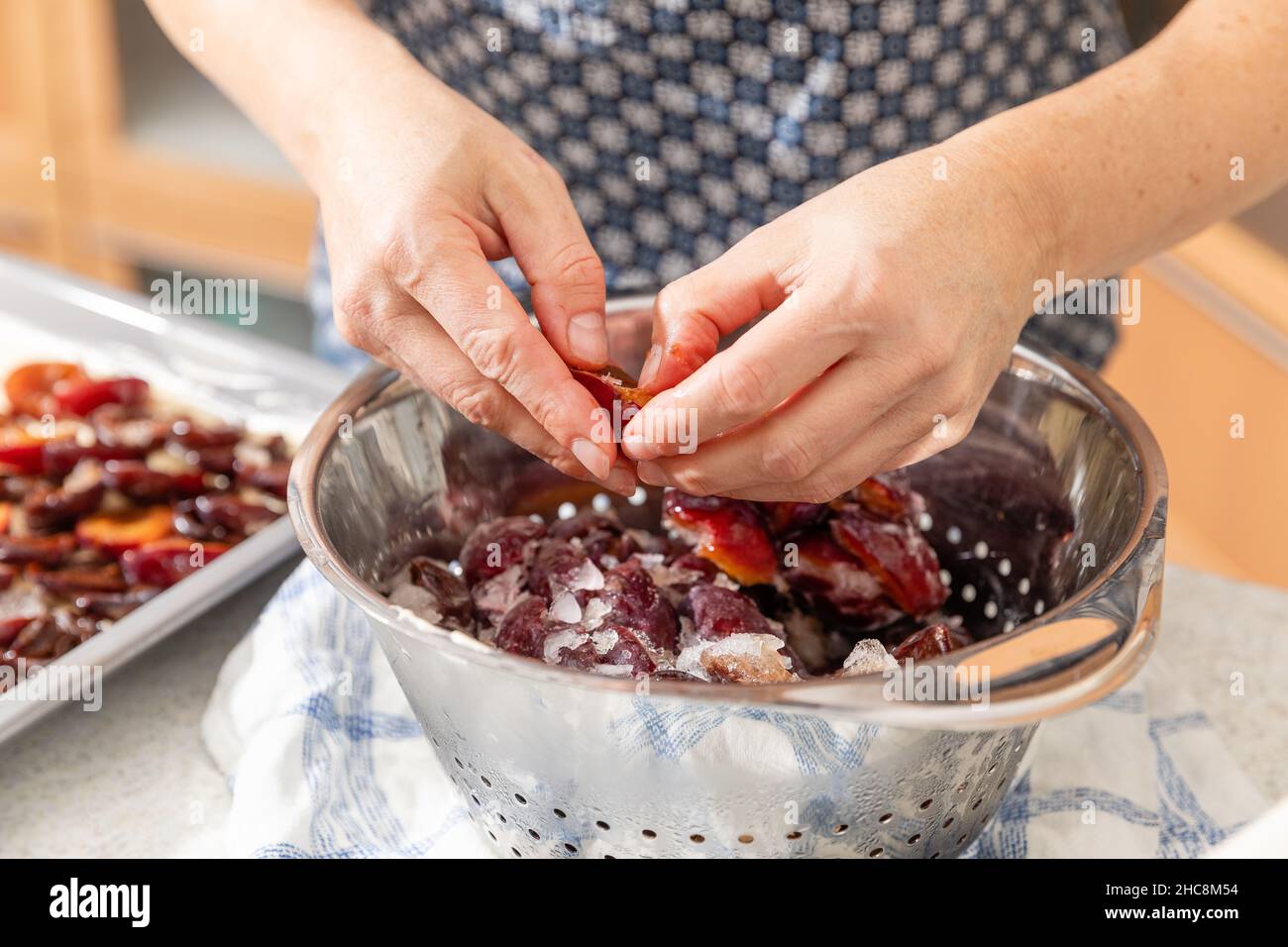 Baking plum cake in the kitchen Stock Photo
