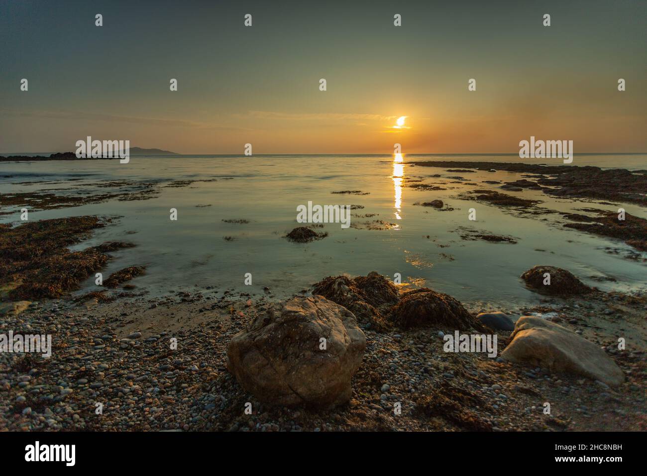 Sunset at Church Bay, Anglesey, North Wales Stock Photo