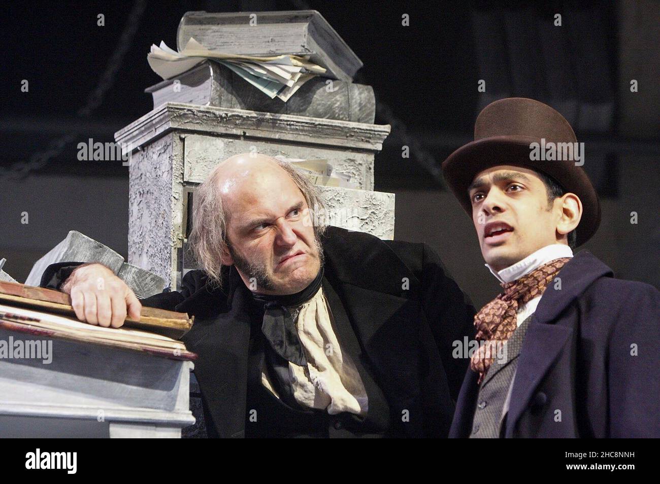 l-r: John Ramm (Ebenezer Scrooge), Amit Shah (Young Scrooge) in A CHRISTMAS CAROL by Charles Dickens at the Rose of Kingston, Surrey, England  04/12/2008  adapted for the stage by Karen Louise Hebden  set design: Simon Higlett  costumes: Mark Bouman  director: Stephen Unwin Stock Photo