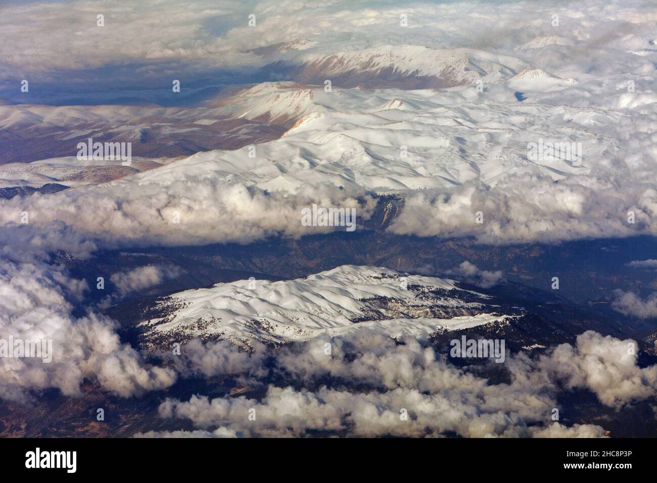 Greece Mountain range, the Pindus, north Greece, covered in winter snow, viewed from a passenger plane, Europe Stock Photo