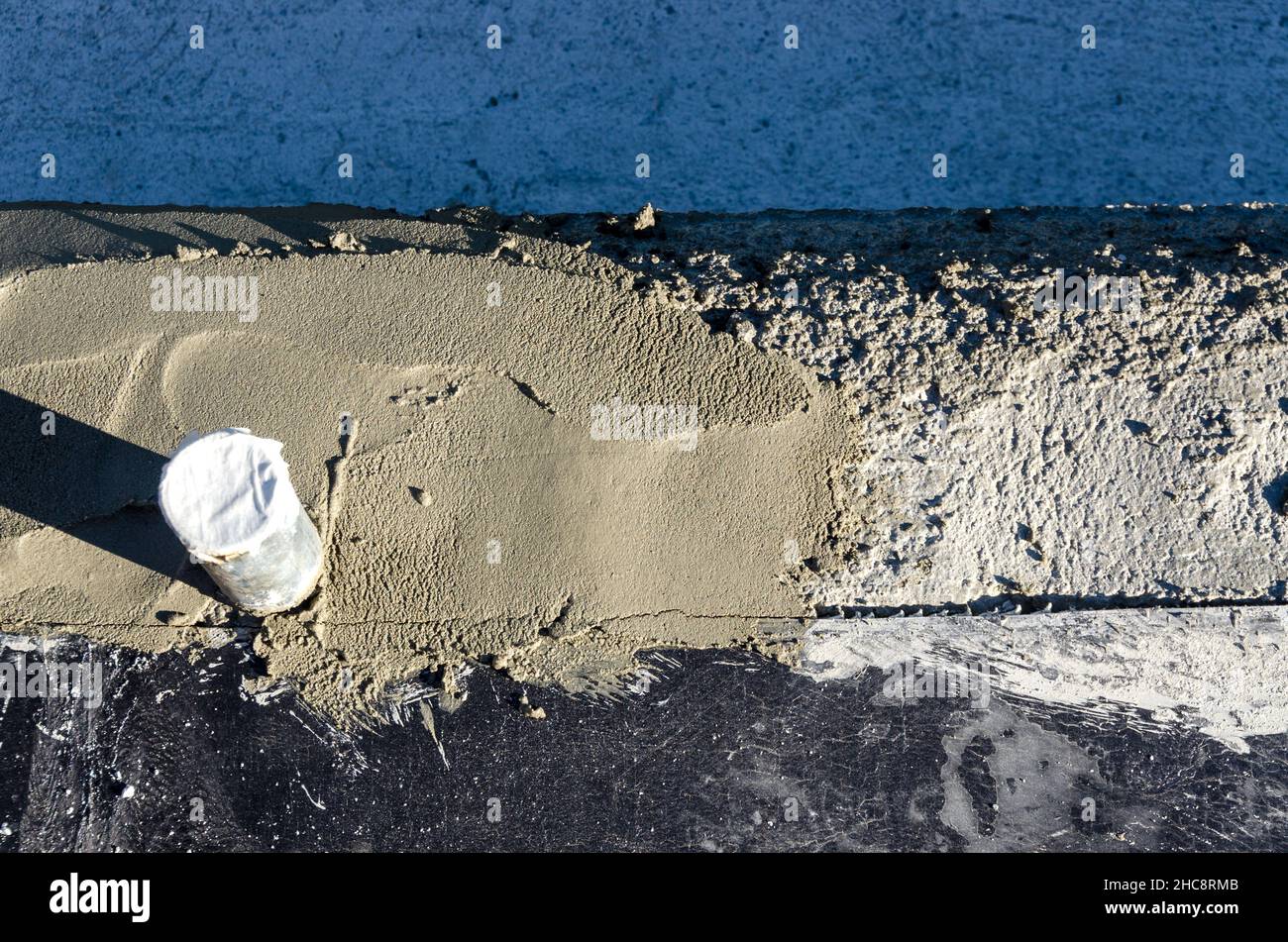 laying of waterproofing sheathing  and insulation during the renovation of a roof in Italy Stock Photo
