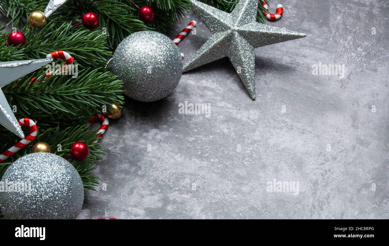 Christmas decorations, pine tree leaves, balls, berries on grunge background, Selective focus christmas concept Stock Photo