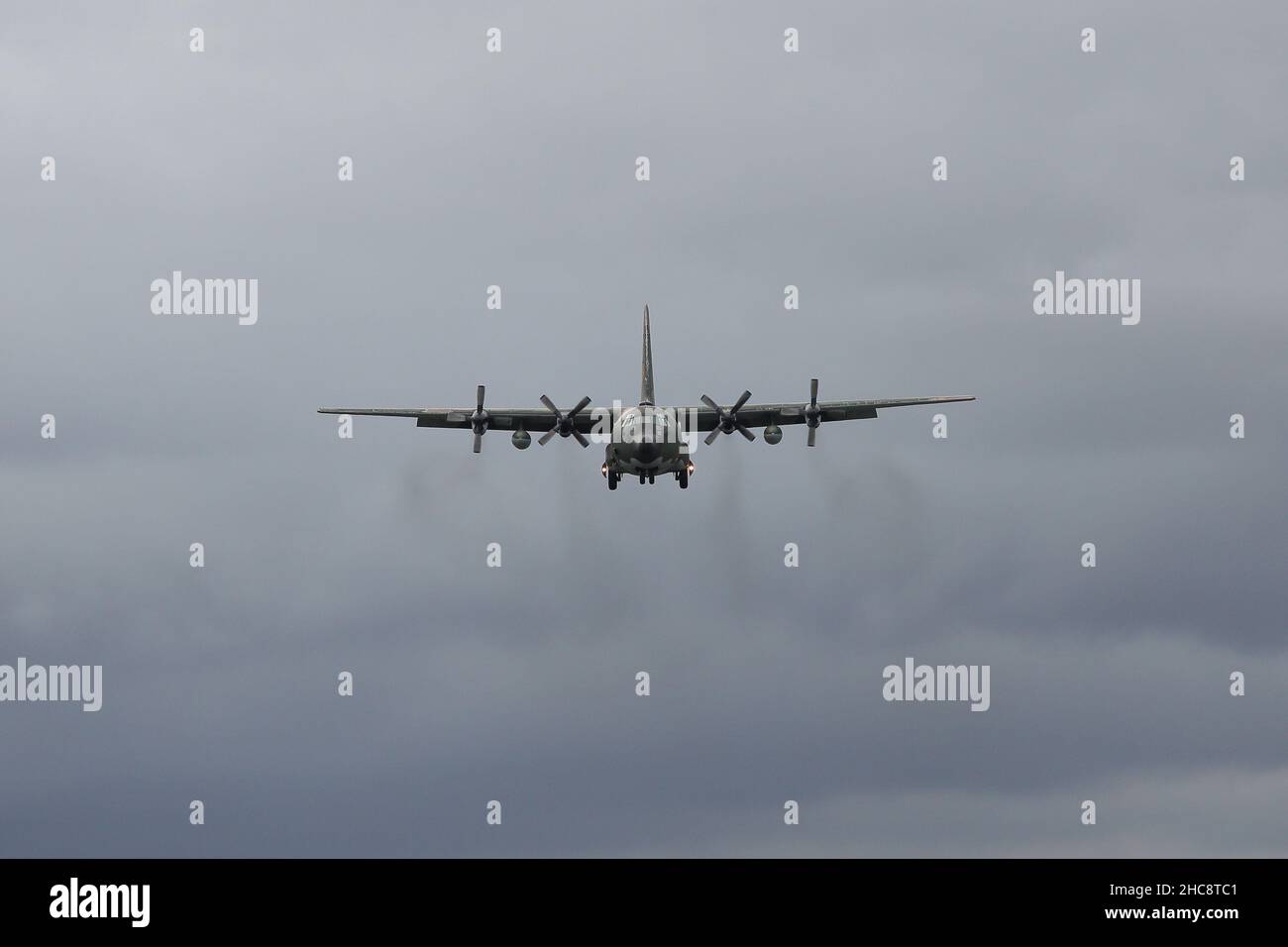 Lockheed C-130 Hercules military transport aircraft in the sky near Taipei Songshan Airport Stock Photo