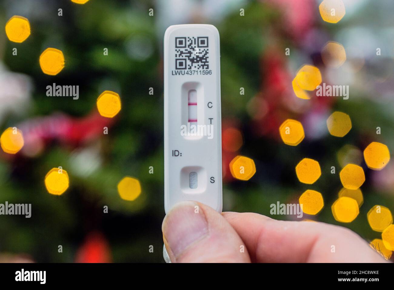 Male does a lateral flow test for coronavirus at home. Stock Photo