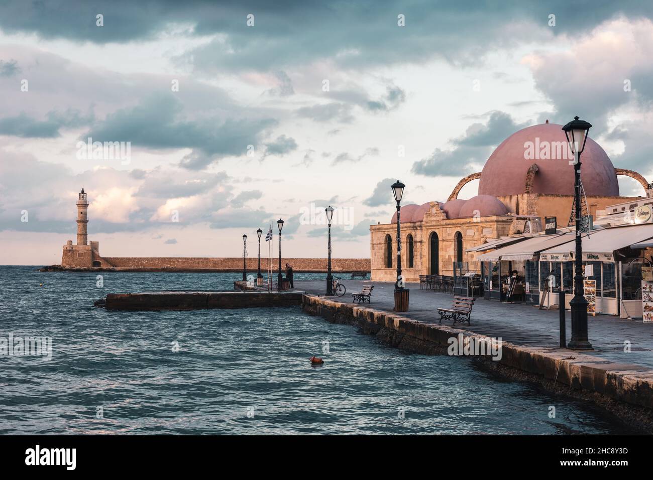 Lighthouse and Hassan Pascha Mosque at the Venetian port in old town of Chania - Crete Island, Greece Stock Photo