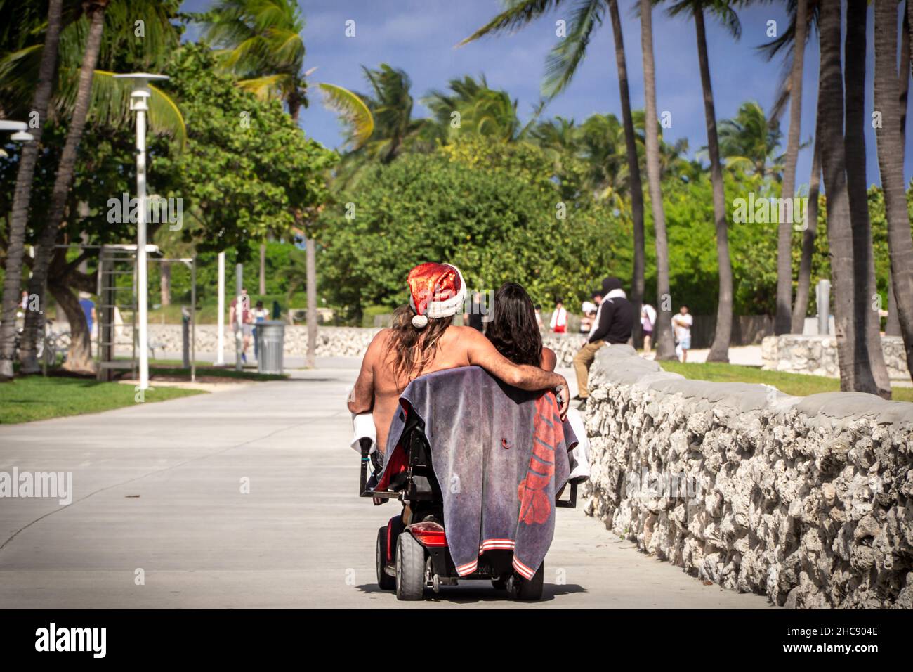 Santa Using A Walker Santa and his little helper on electric wheelchair Stock Photo - Alamy
