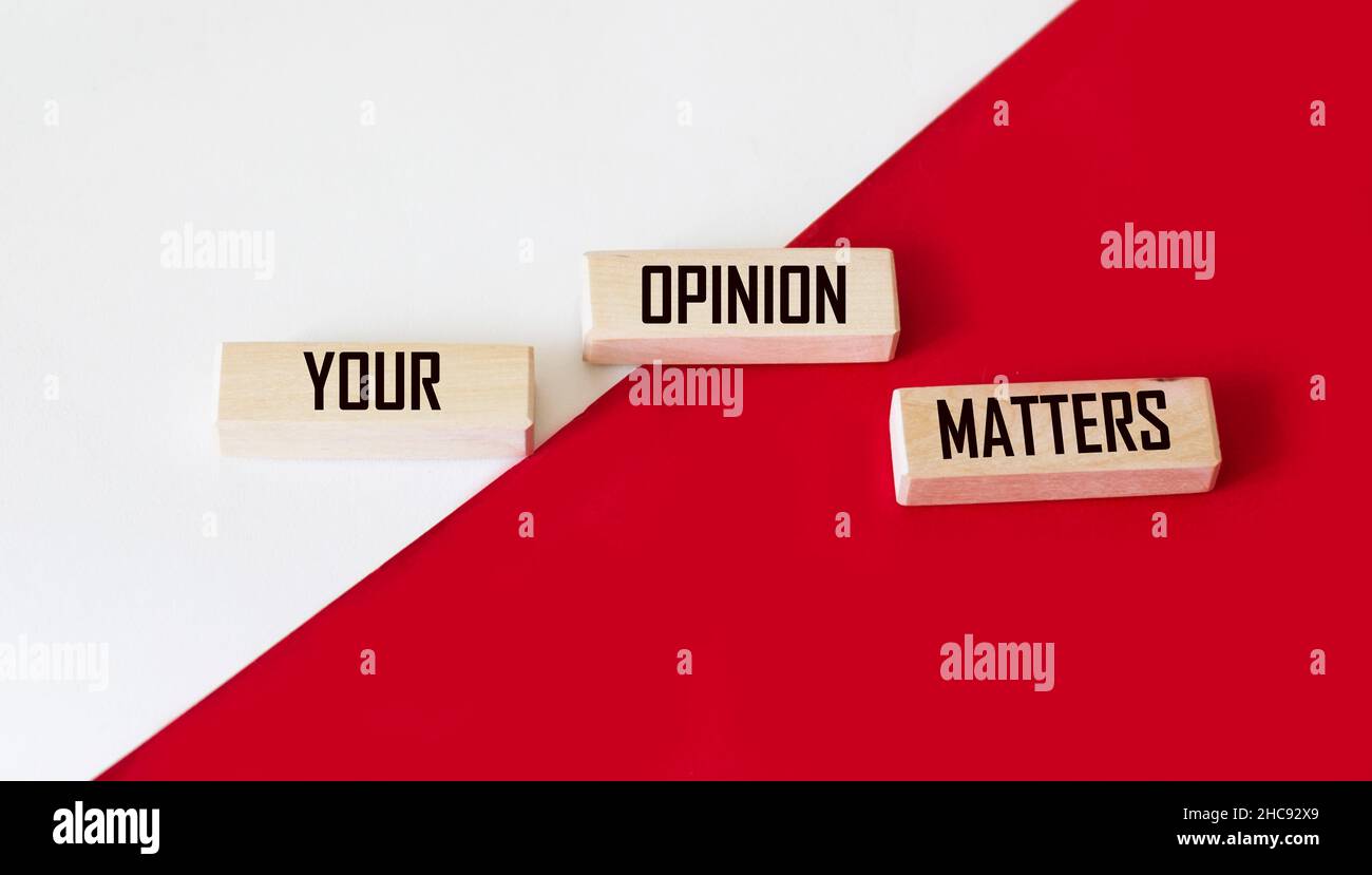 Your opinion matters - words from wooden blocks with letters on a white and red background. Your feedback is important concept, top view. Stock Photo