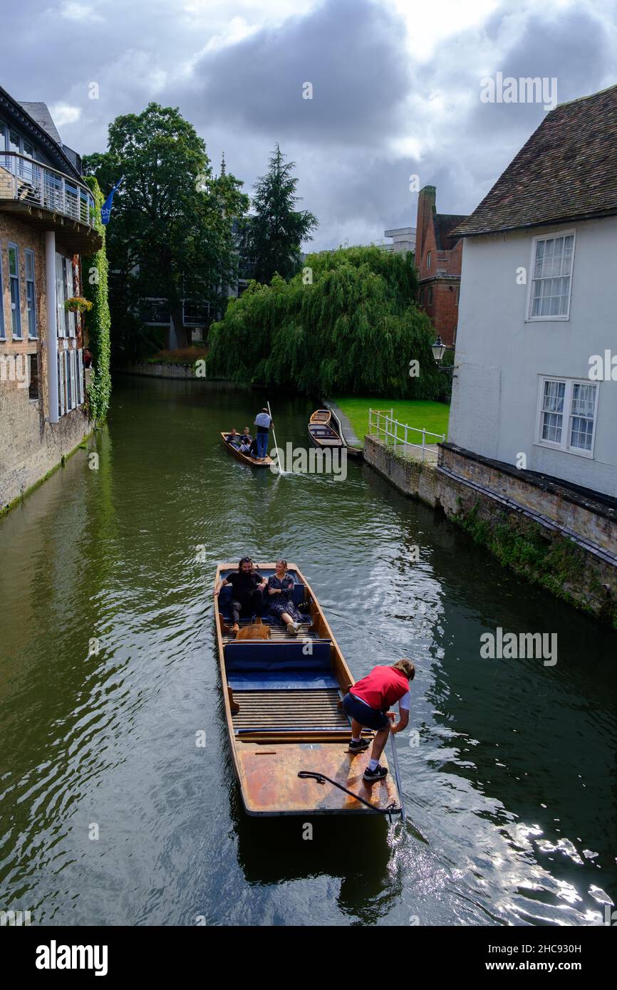 Cambridge, United Kingdom - August 1, 2021: Tourist punting on the river Cam, viewed from Magdalene bridge. Stock Photo