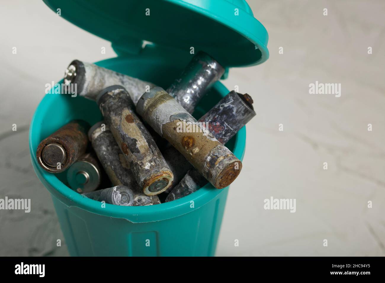 Corroded waste batteries. Fingertype batteries and accumulators for