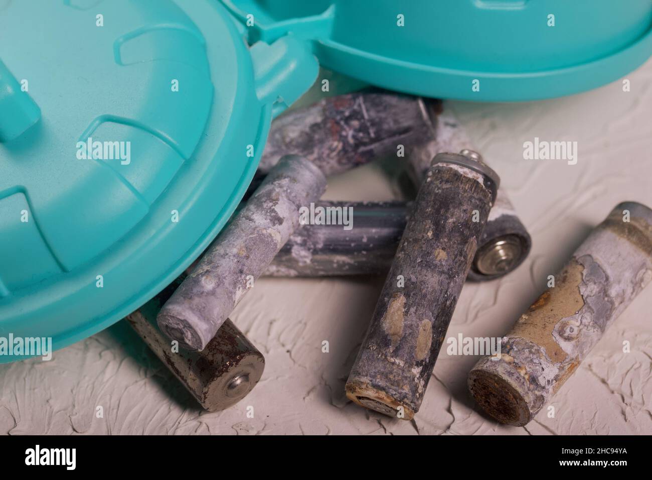 Corroded waste batteries. Fingertype batteries and accumulators for