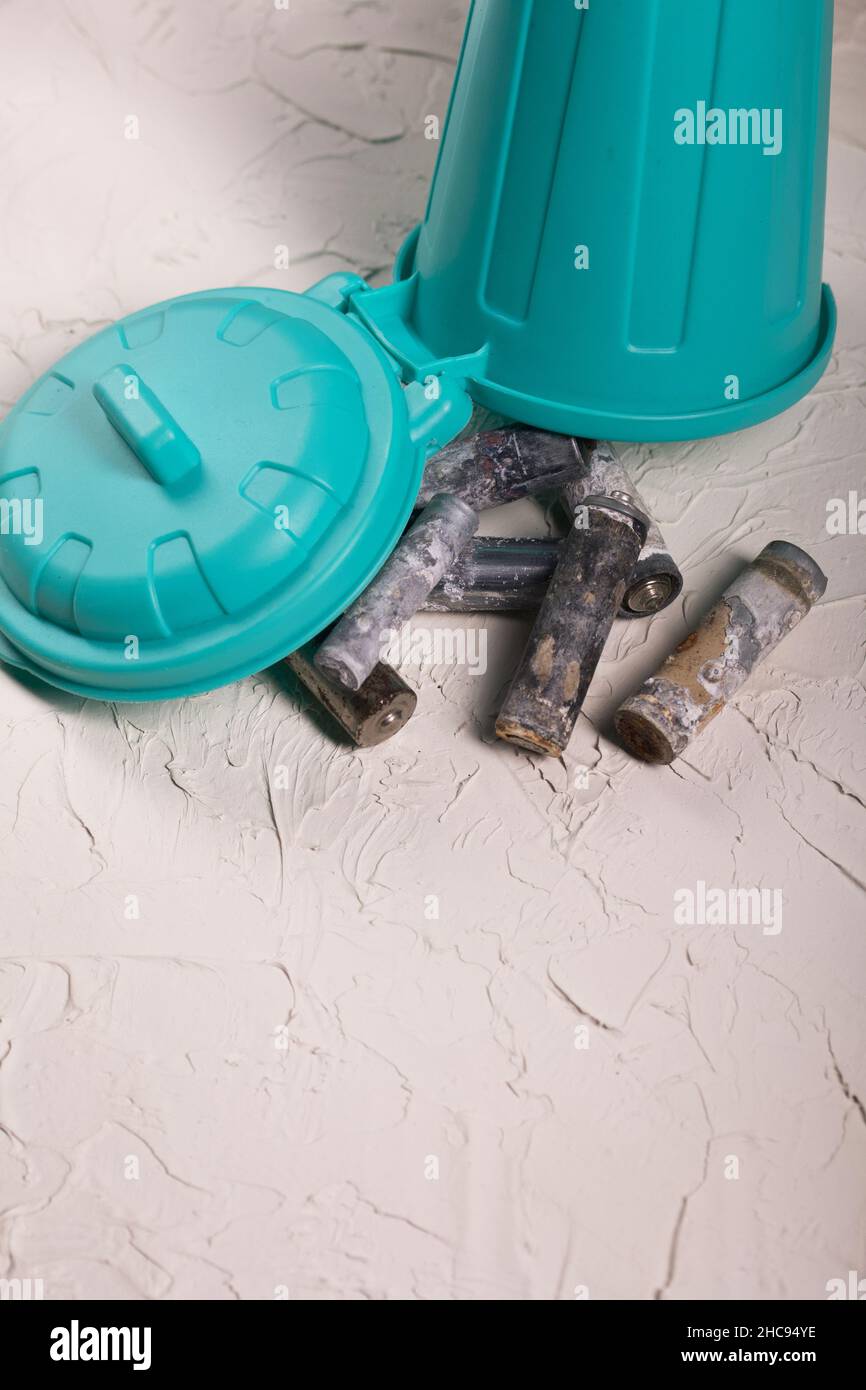 Corroded waste batteries. Fingertype batteries and accumulators for