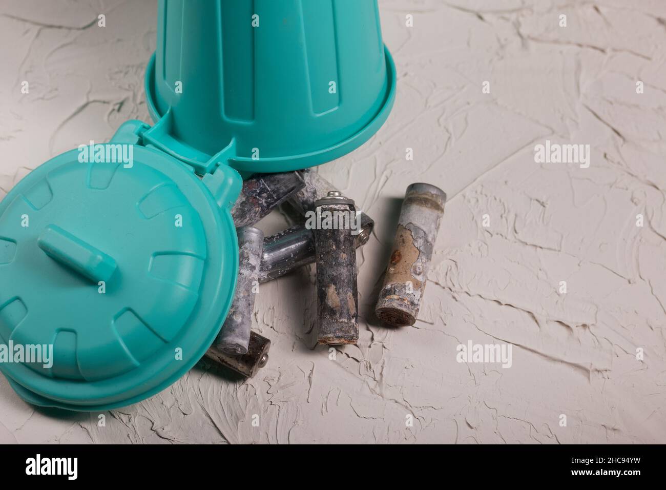 Corroded waste batteries. Fingertype batteries and accumulators for