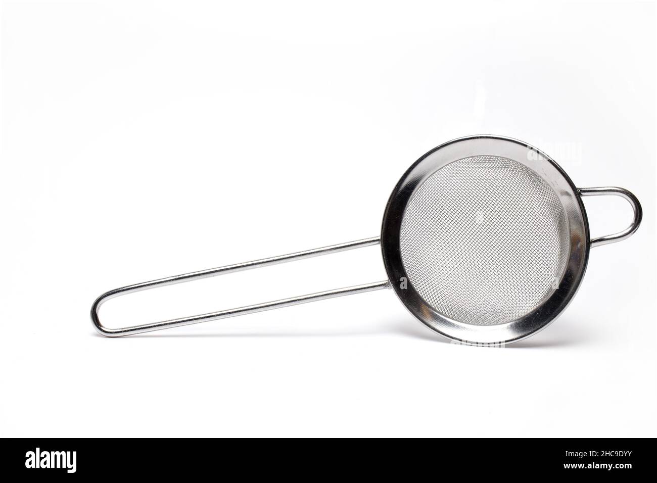 Close up of small silver metal strainer tea kitchen strainer isolated