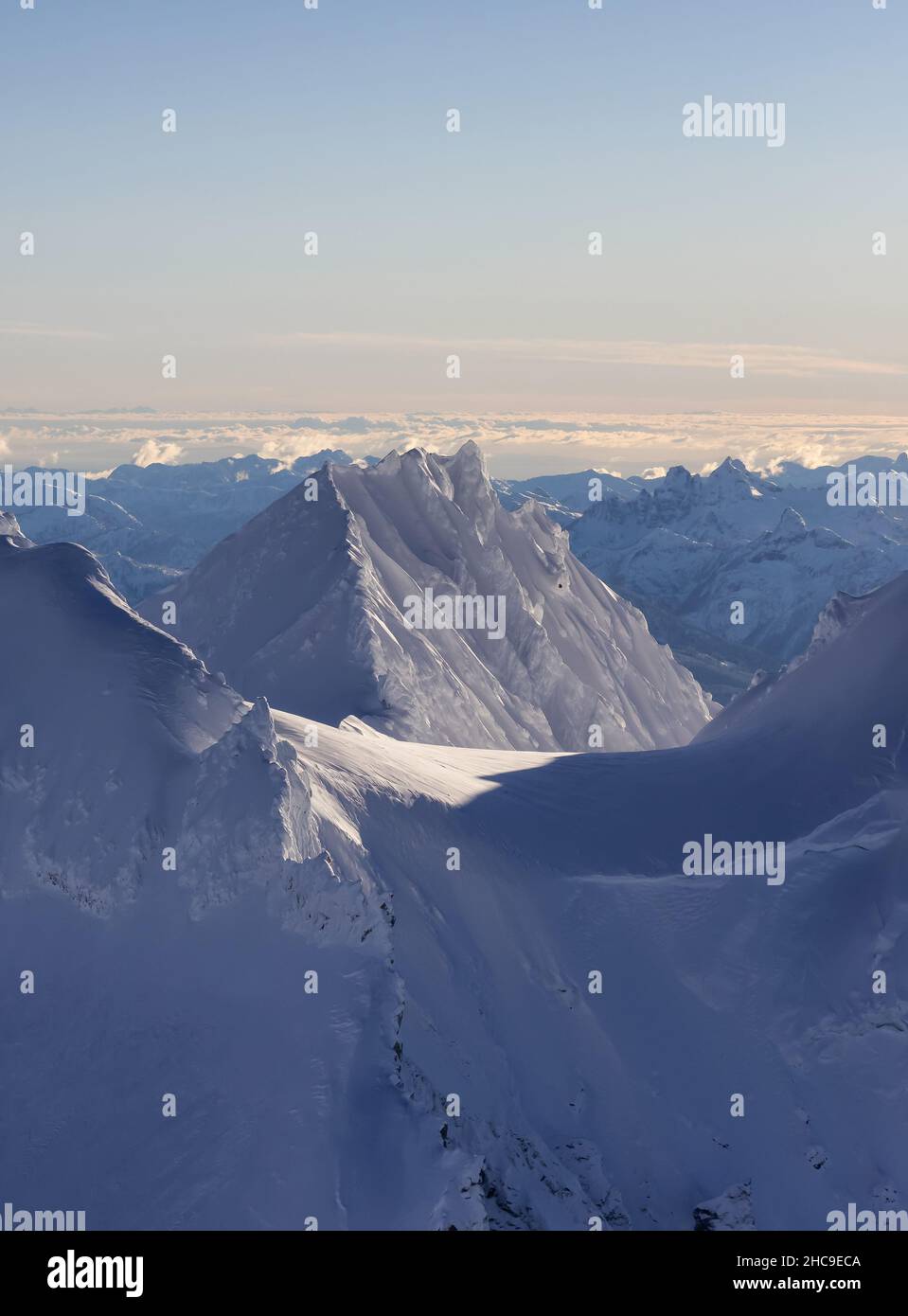 Aerial View of Canadian Mountain covered in snow Stock Photo - Alamy