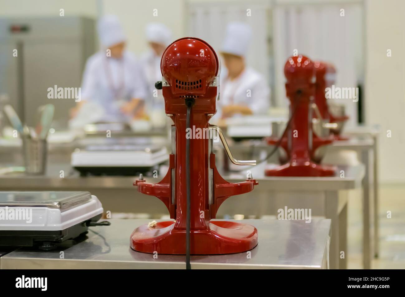 Professional chef workplace with modern food mixers at cuisine of