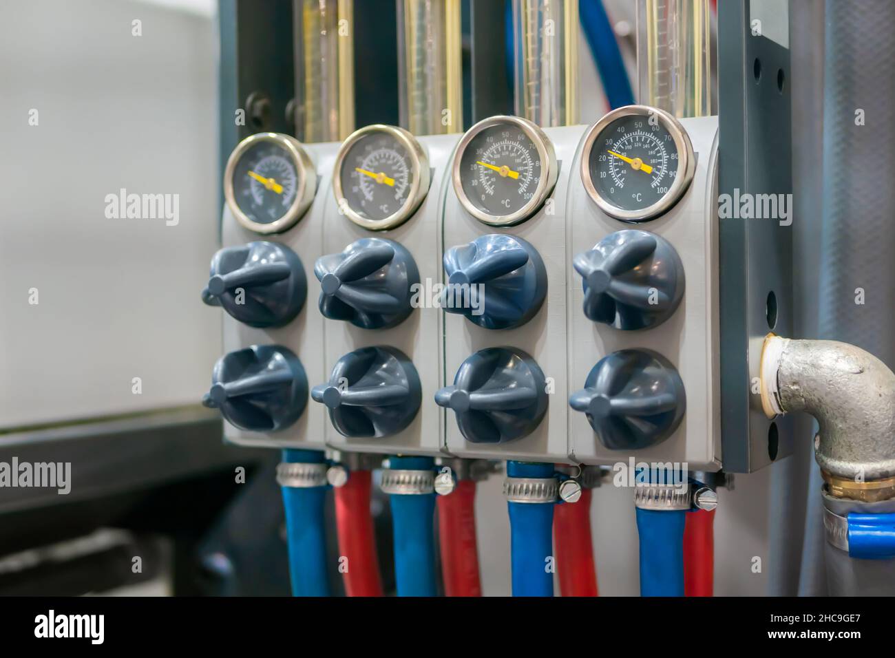 Flowmeter, rotameter - flow regulator for cooling system of injection machine Stock Photo