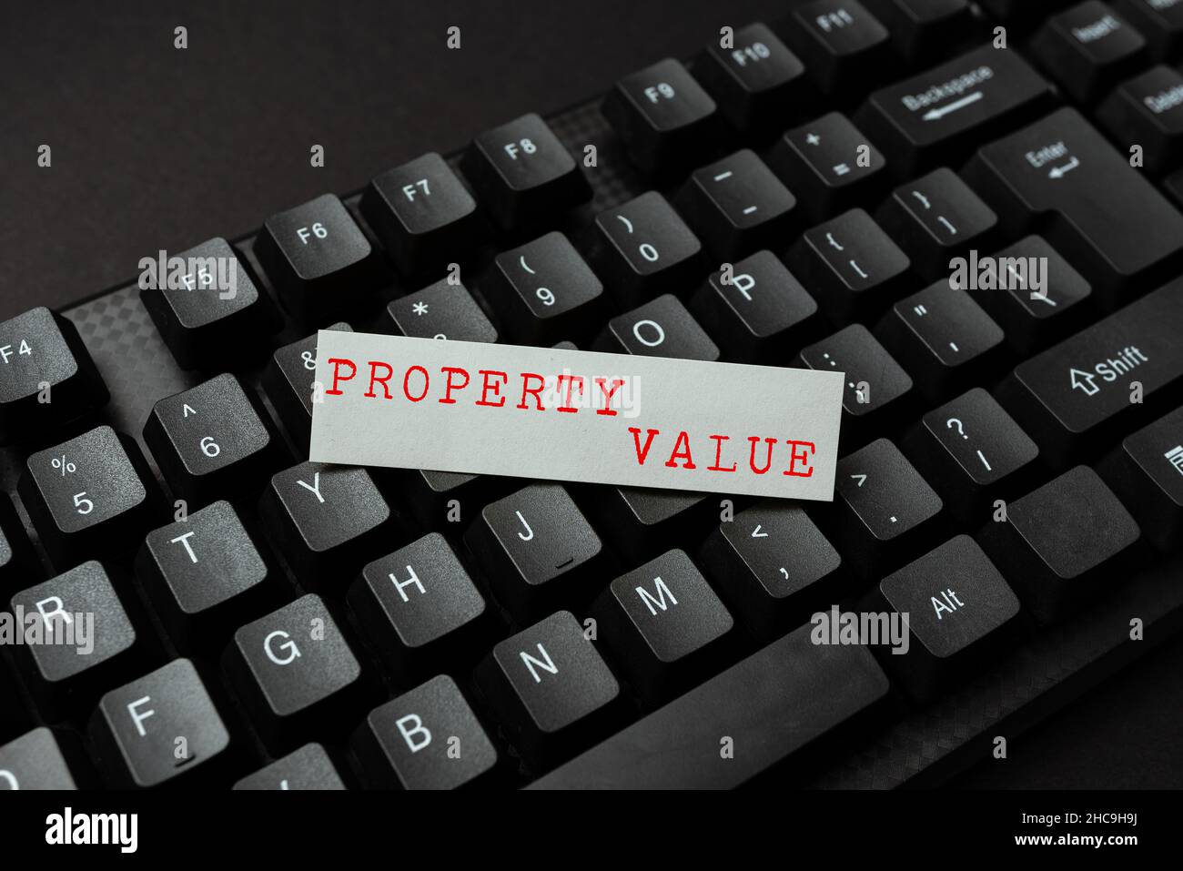 Text showing inspiration Property Value. Business idea Worth of a land Real estate appraisal Fair market price Entering New Programming Codes, Typing Stock Photo