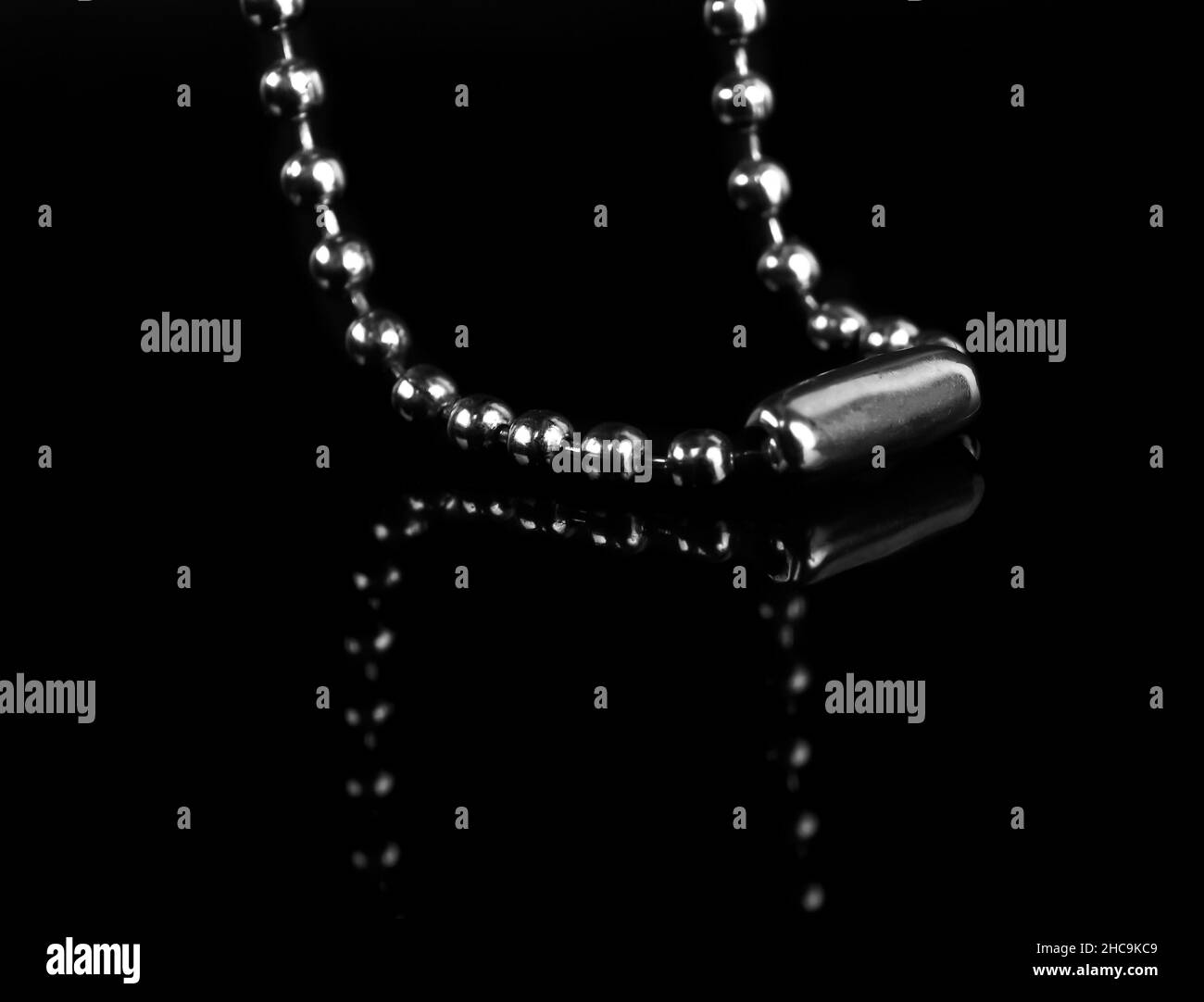 chain for a keychain, on a black background isolated with reflection Stock Photo