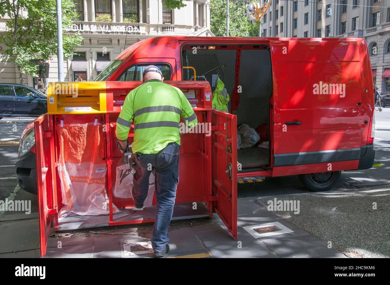 Australia Post staff clearing a street mail box, Melbourne Stock Photo