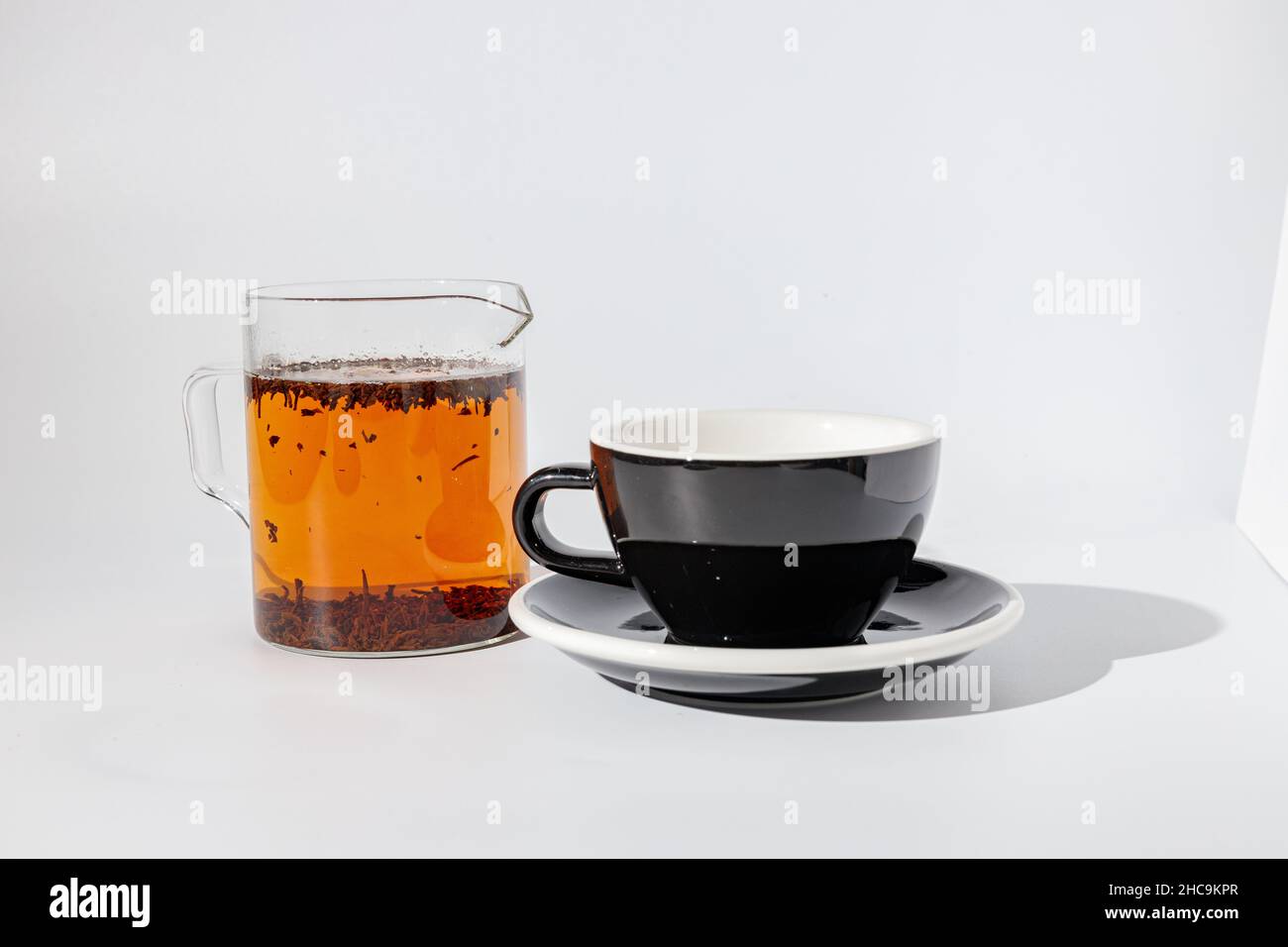 Black cup with sauce for drinking beverage Stock Photo