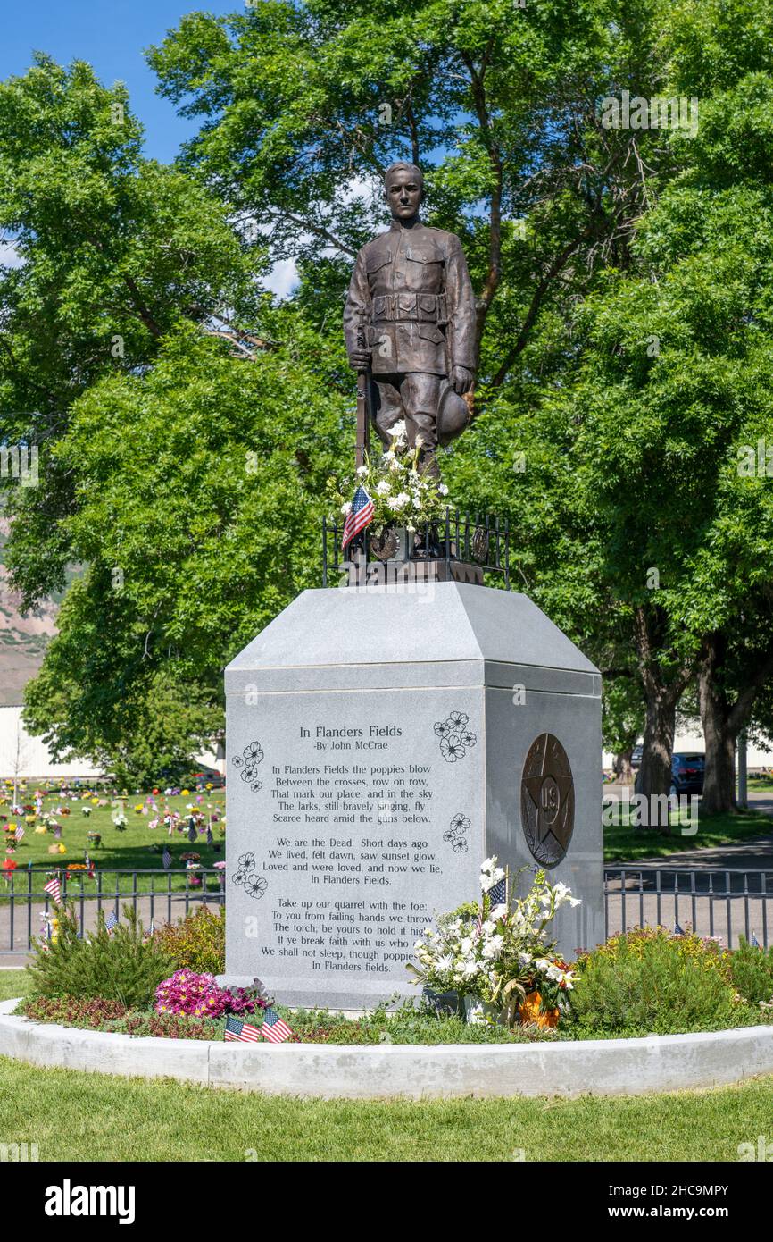 A statue in a cemetery memorializing John McCrae, the Canadian soldier who wrote the poem "In Flanders Fields.  "Memorial Day is an American holiday t Stock Photo