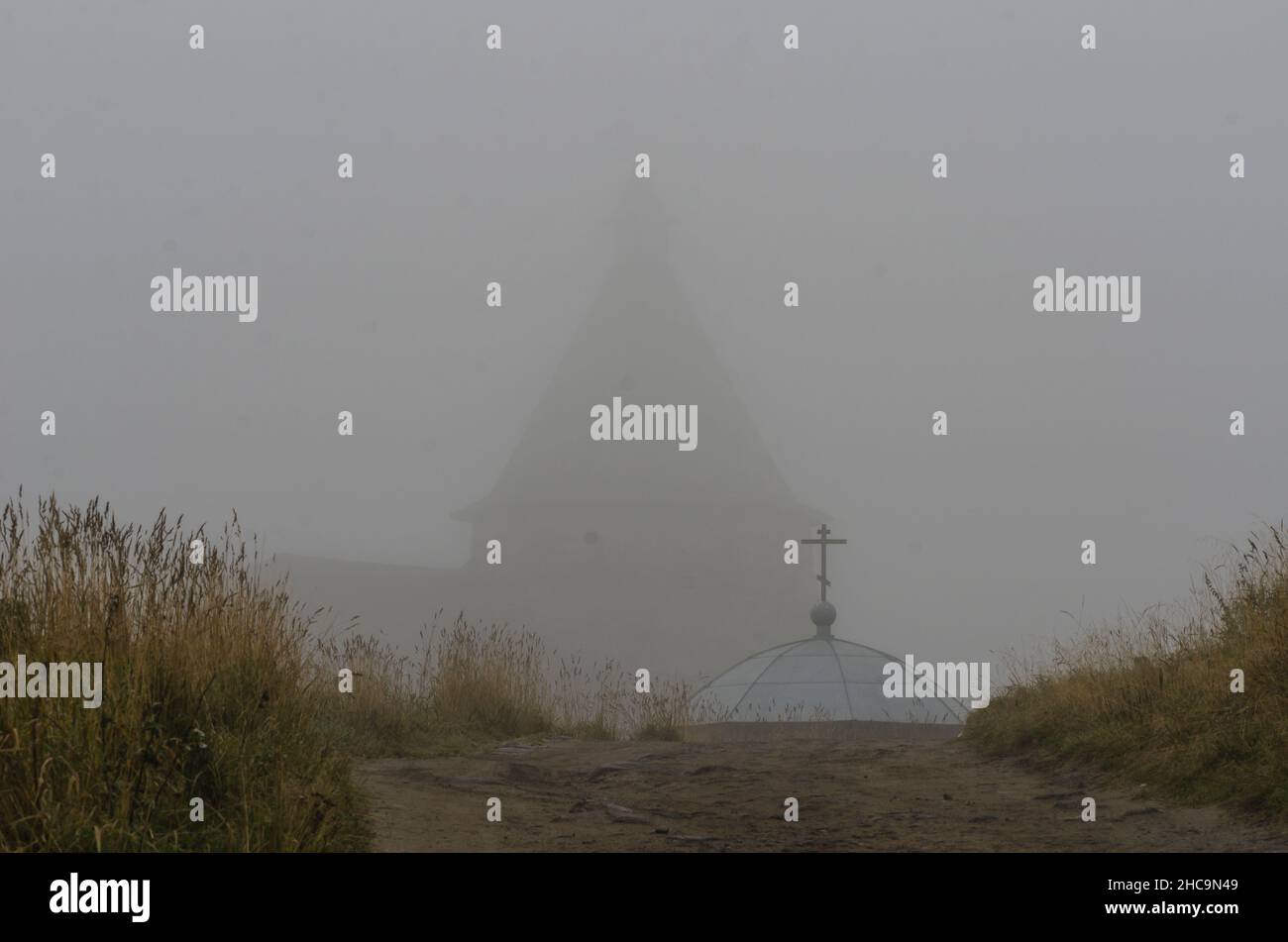 View of the Solovetsky Monastery in the fog. Fortress over water Stock Photo