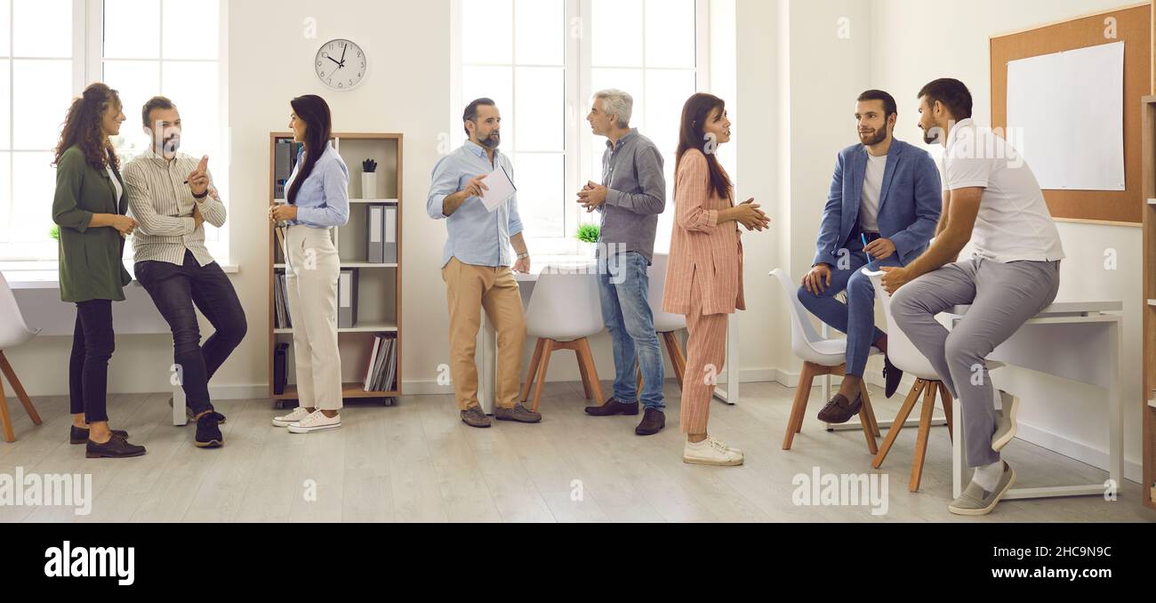 Groups of business people having informal discussions after work meeting in office Stock Photo